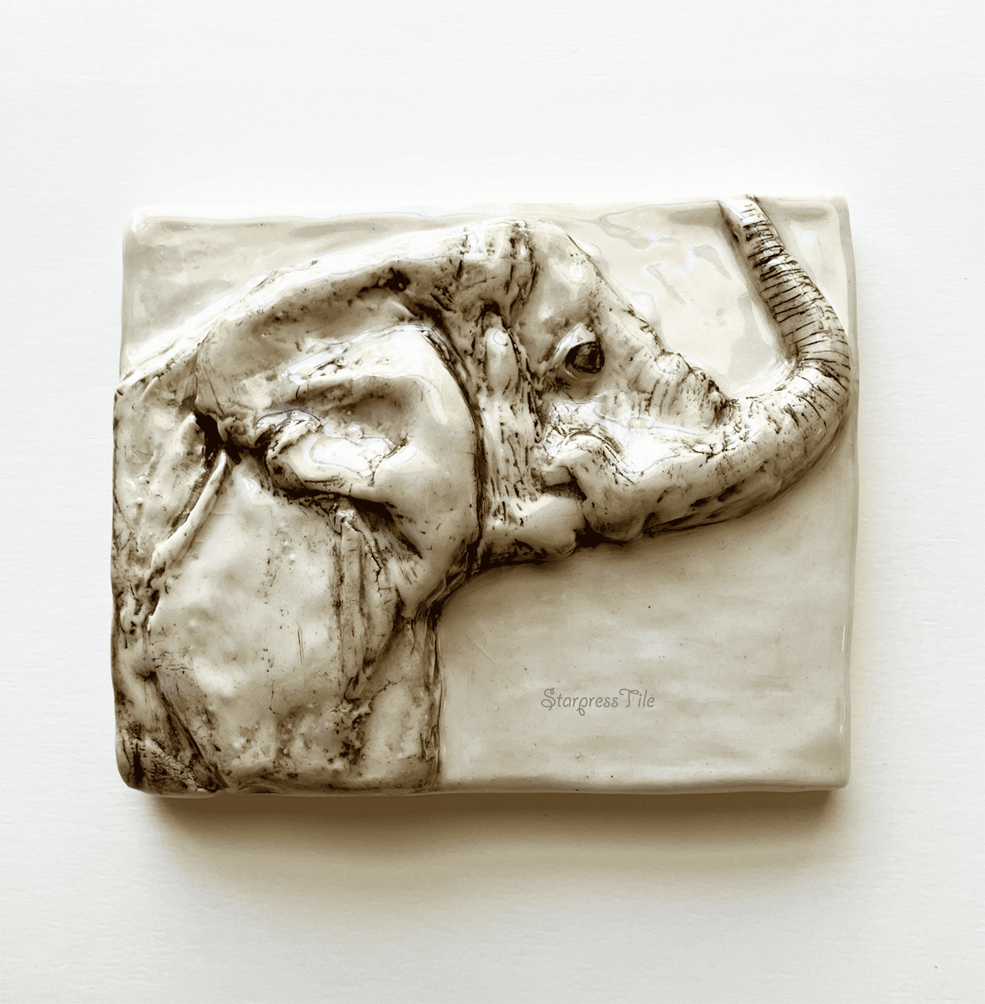 Relief elephant ceramic art tile with brown highlight
