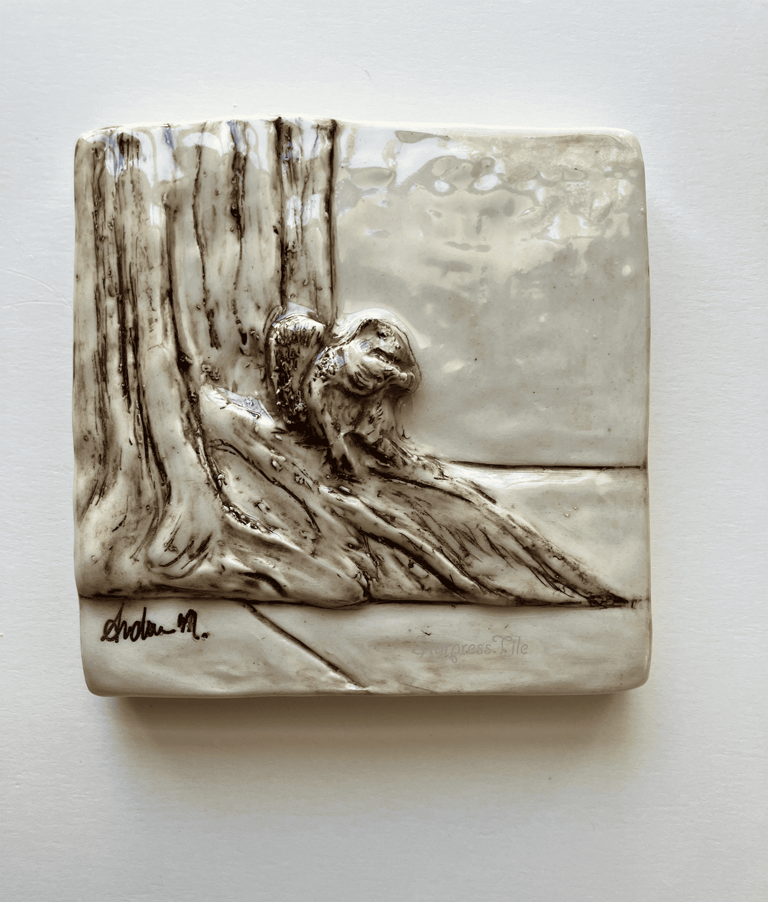 Relief ceramic tile, Squirrel sitting by tree trunk